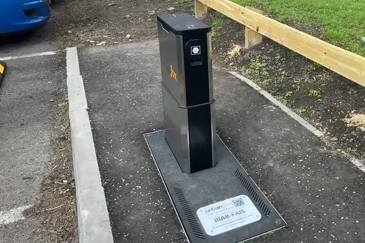 An Urban Fox UEone retractable chargepoint in a parking bay