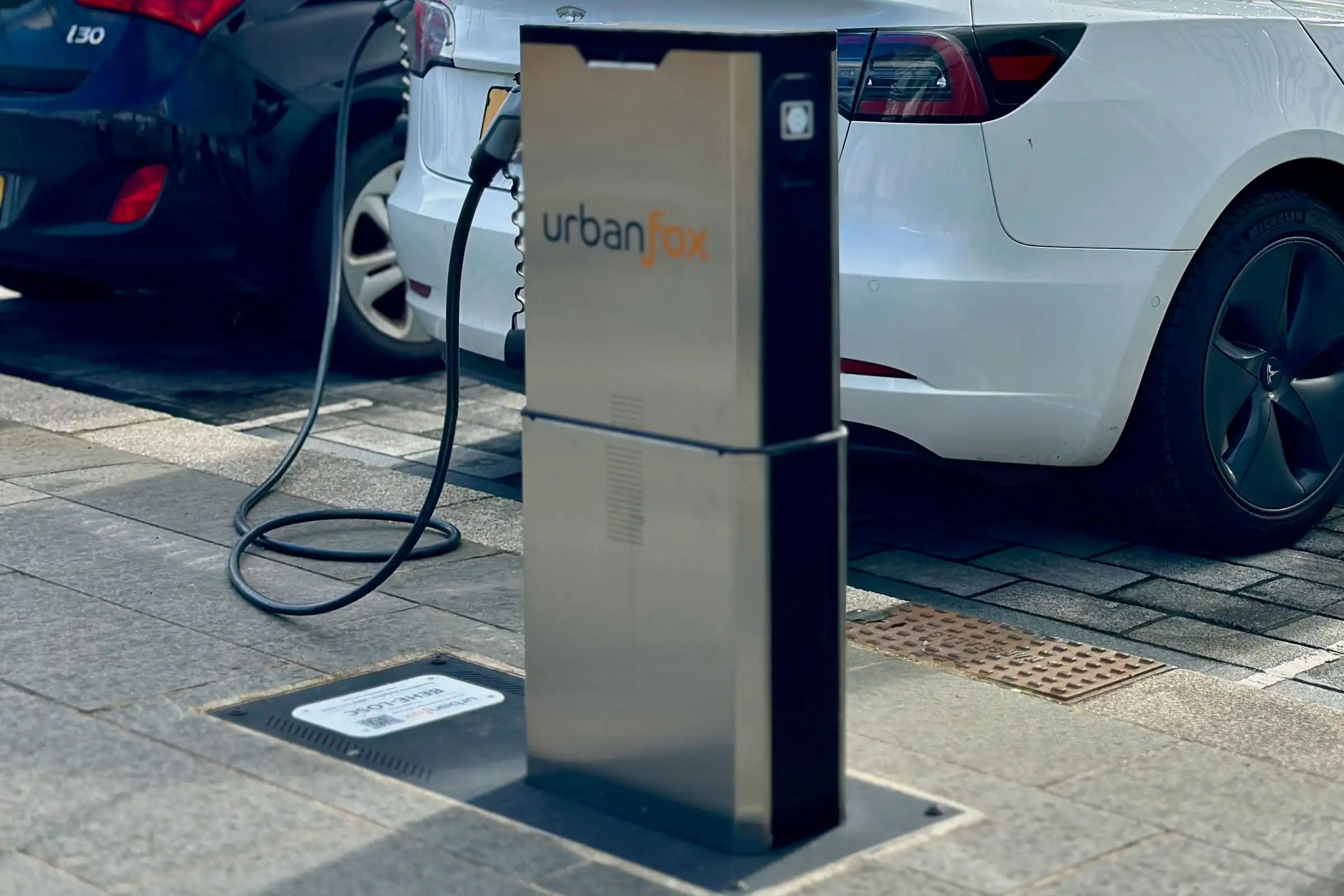 An Urban Fox chargepoint charging an electric car in a car park
